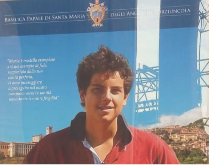 Carlo Acutis manifesto mostra apparizioni mariane in Assisi